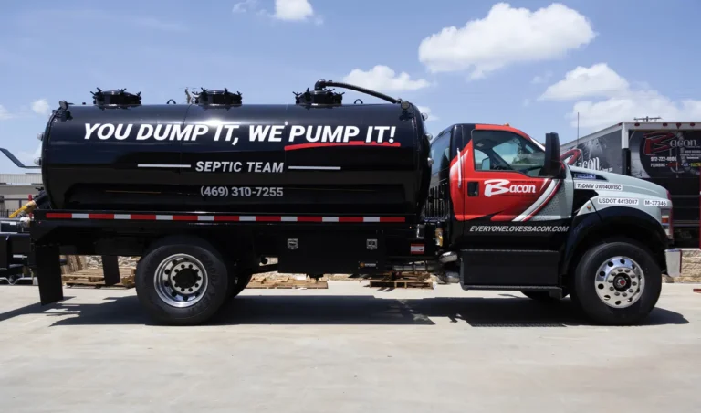Bacon Plumbing Heating Air Electric septic pump truck with bold black-and-red wrap design and large slogan across the tank.