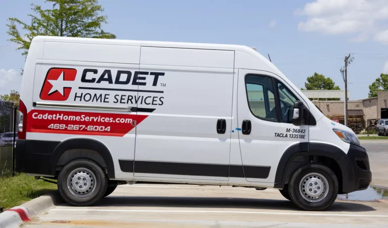 Cadet Home Services ProMaster van with a clean red, white, and black wrap design featuring prominent company branding.